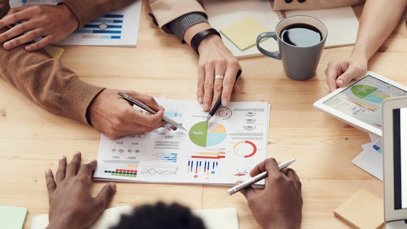 Business professionals engaged in a strategic meeting in a modern office setting