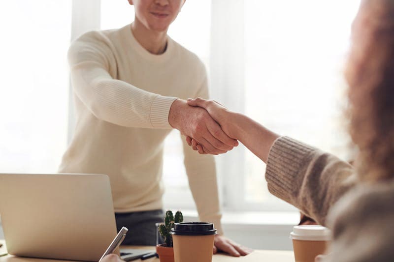 Focus on employer branding with documents on a wooden desk