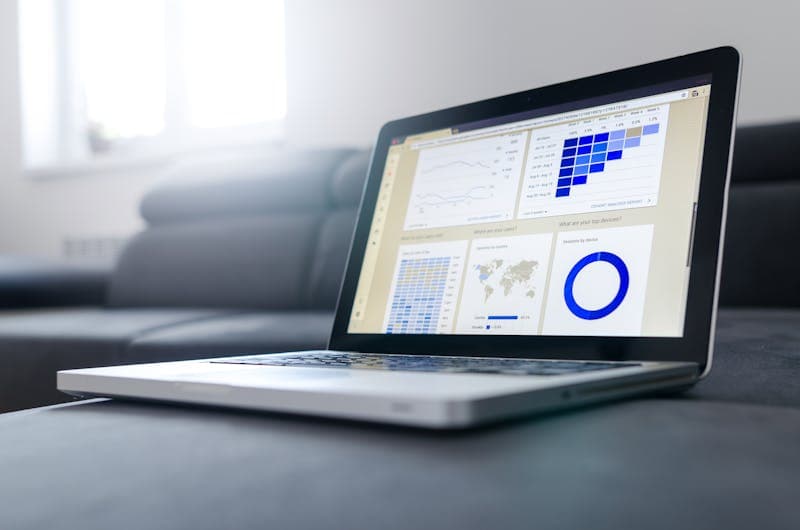 Sleek laptop showcasing data analytics and graphs on the screen